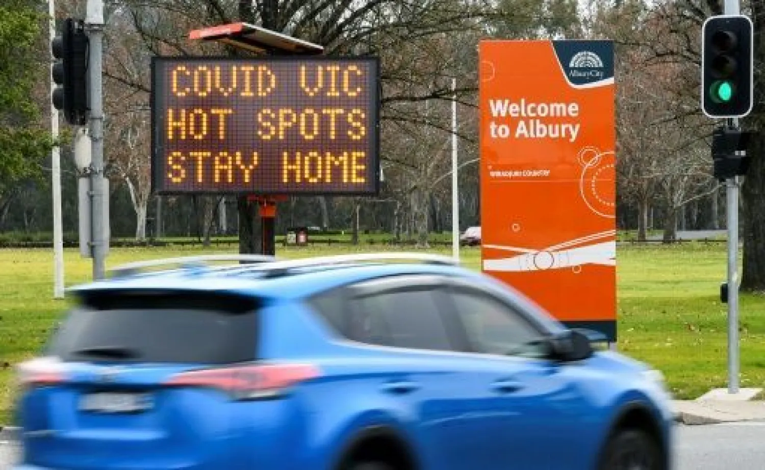 Australia has ordered millions locked down in its second-biggest city, and effectively sealed off Victoria state to combat a new coronavirus surge | AFP