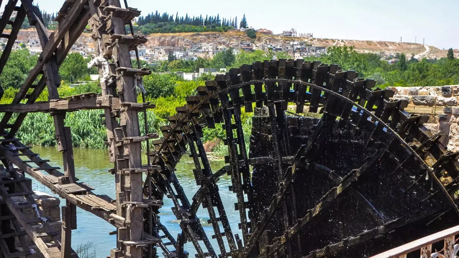 The water wheels or ‘norias’ of Hama were used for centuries to bring water to gardens and buildings on the shores of the Orontes River. (AFP)