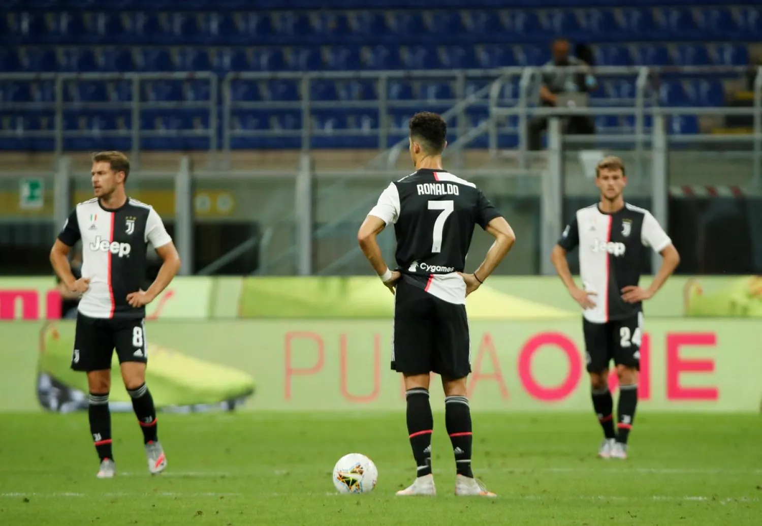 Juventus' Aaron Ramsey, Cristiano Ronaldo and Daniele Rugani look dejected during the Serie A match against AC Milan on Tuesday. (Reuters)