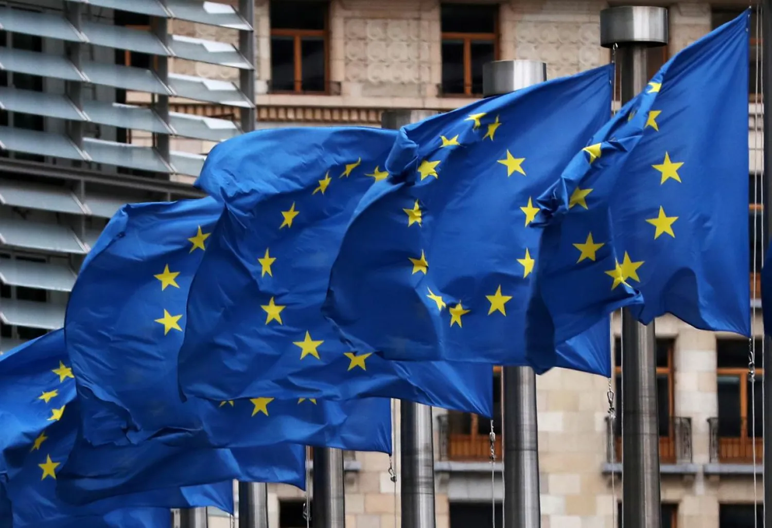 FILE PHOTO - European Union flags fly outside the European Commission headquarters in Brussels, Belgium, March 6, 2019. REUTERS/Yves Herman