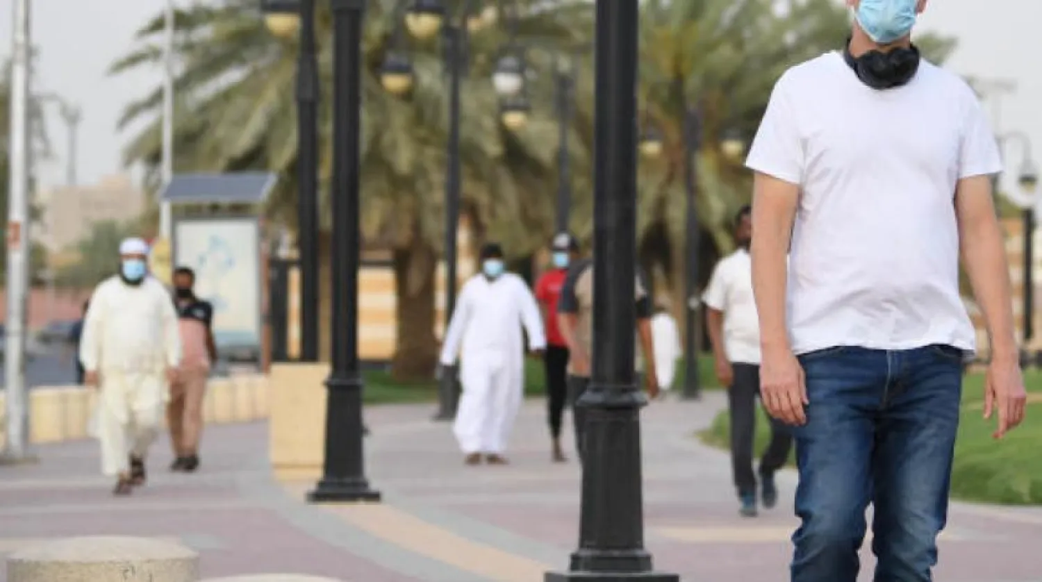 Saudis walking at a square in Riyadh. Photo by Bashir Salih