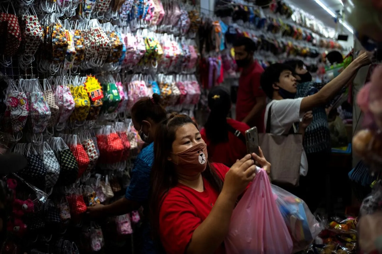 People shop for face masks inside the Sampheng wholesale market as Thai government eases isolation measures, following the coronavirus outbreak, in Bangkok, Thailand, June 10, 2020. (Reuters)