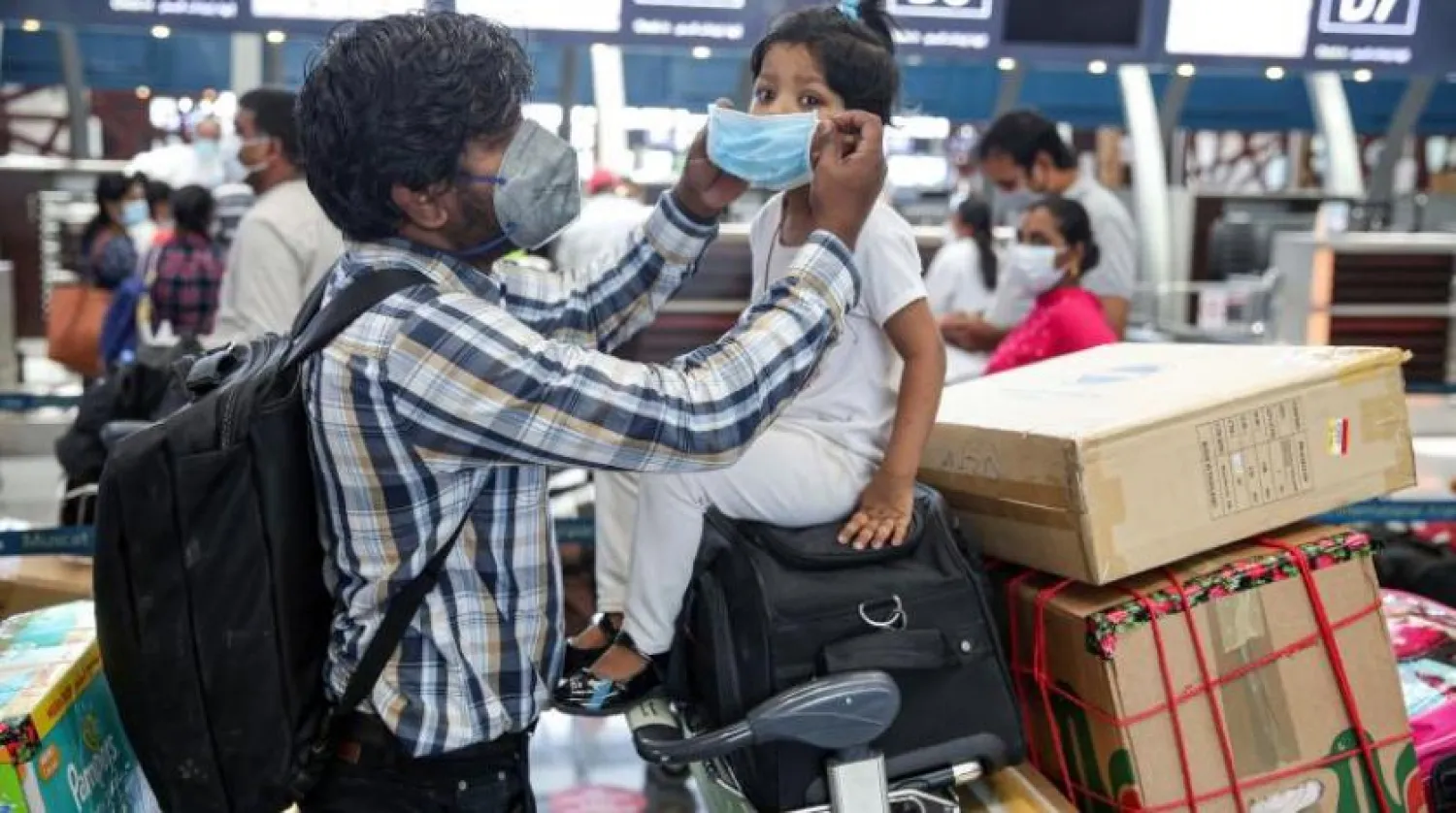 Travelers at Muscat's airport. AFP