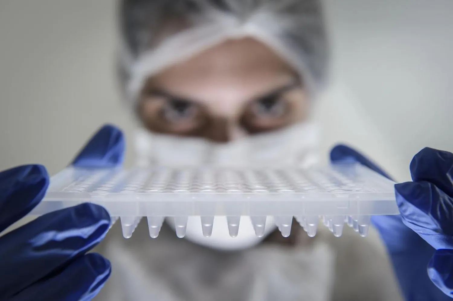 A lab technician holds a PCR plate to perform Covid-19 tests at Hermes Pardini Lab amid the pandemic in Vespasiano, Brazil. (Getty Images)
