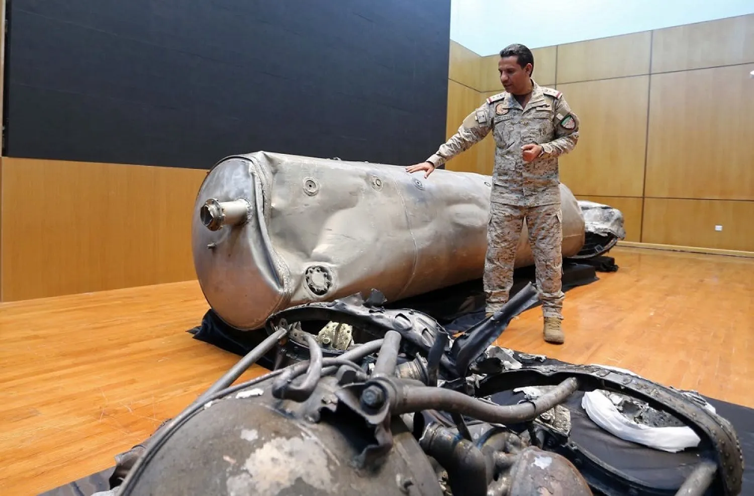 Arab coalition spokesman, Turki al-Malki, displays the debris of a ballistic missile launched by the Houthis towards Riyadh, during a news conference in Riyadh, Saudi Arabia March 29, 2020. (Reuters)