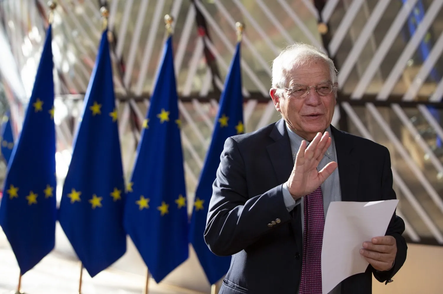 EU foreign policy chief Josep Borrell reads a statement as he arrives for a meeting of EU foreign ministers at the European Council building in Brussels, Monday, July 13, 2020. (AP)