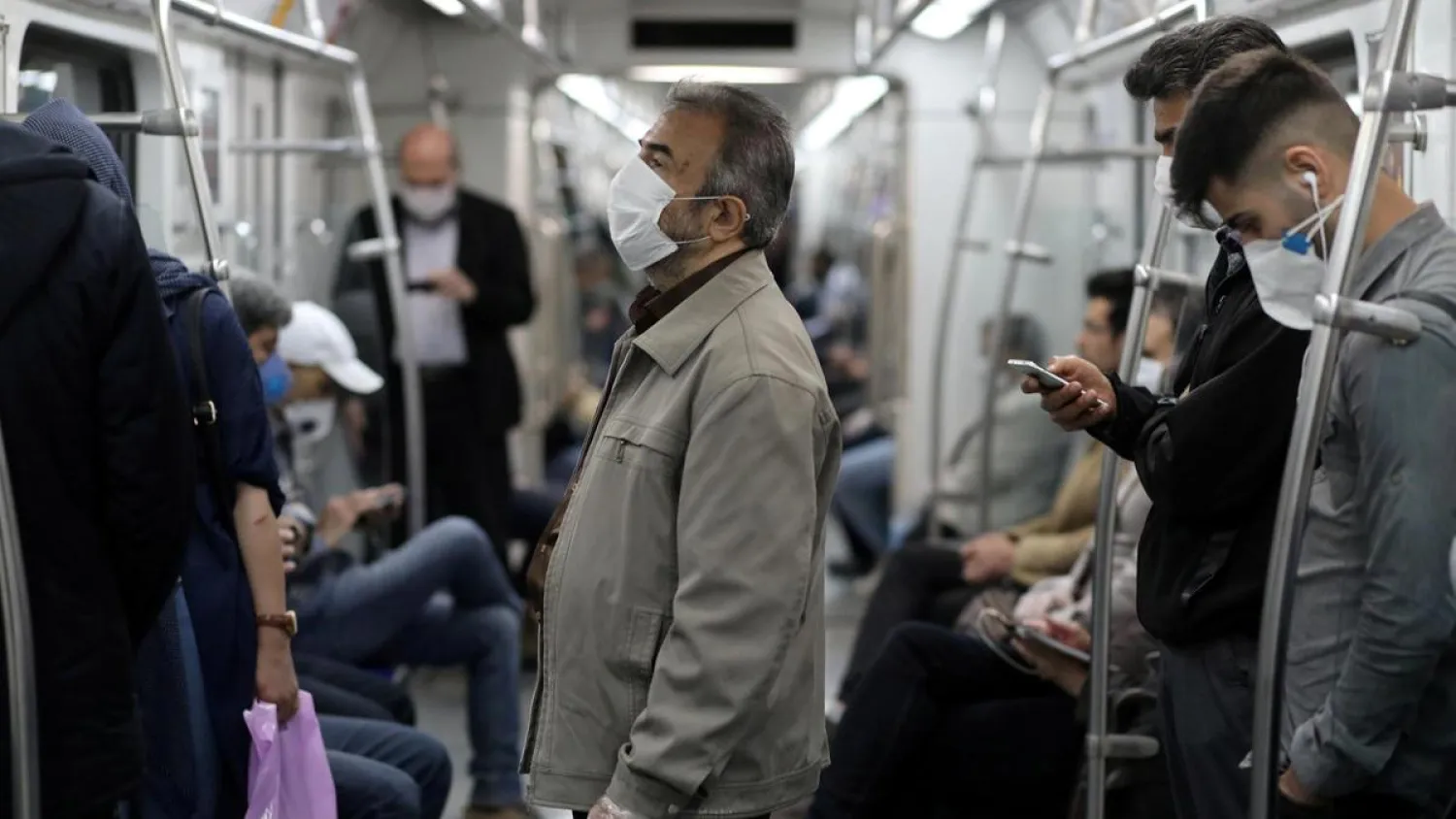 Iranians wear face masks while riding the metro in Tehran, Iran, on May 20, 2020. (Reuters)