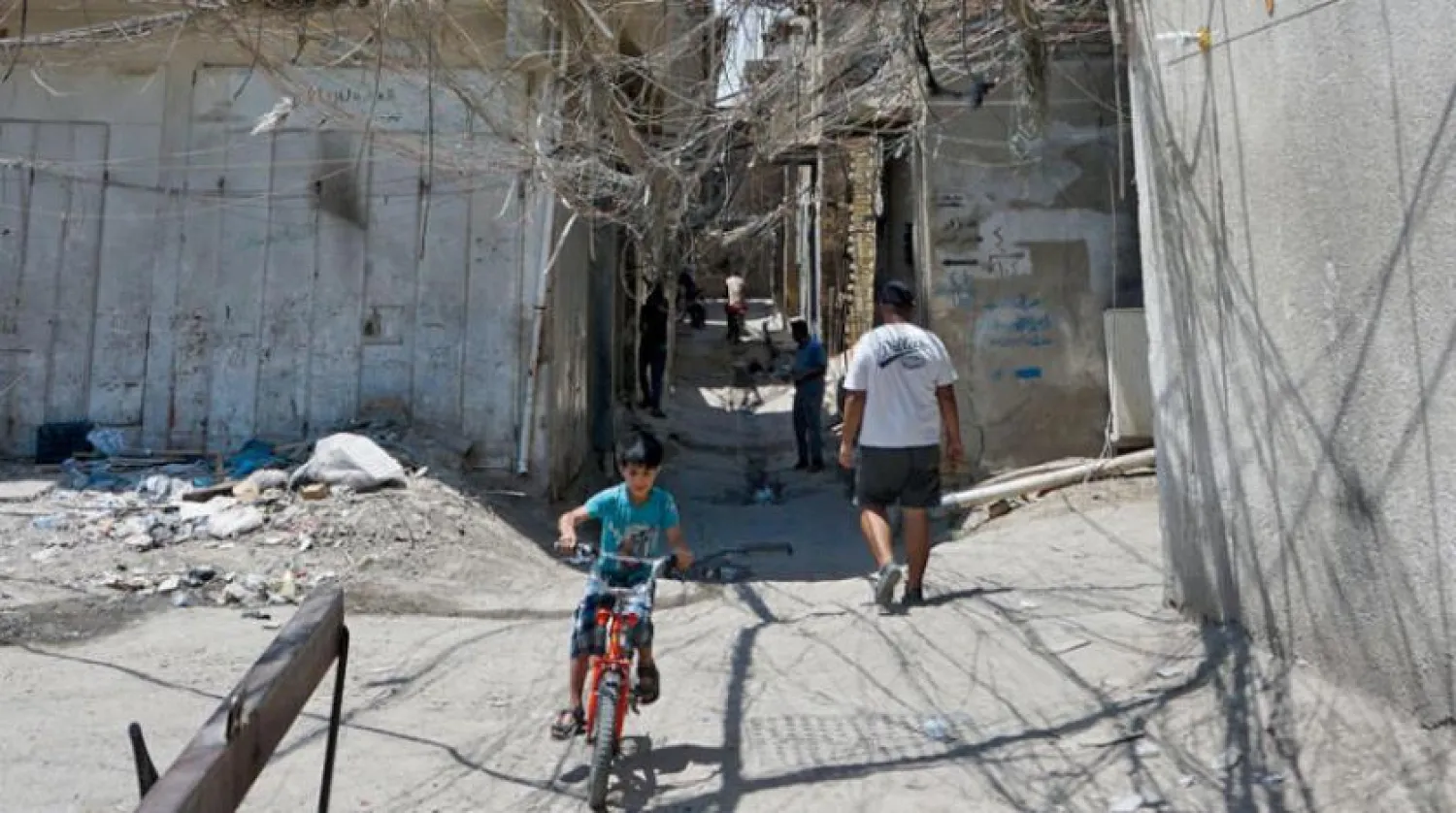 Electrical wires randomly extended in the suburb of Syed Sultan Ali in the Iraqi capital, Baghdad | AFP 