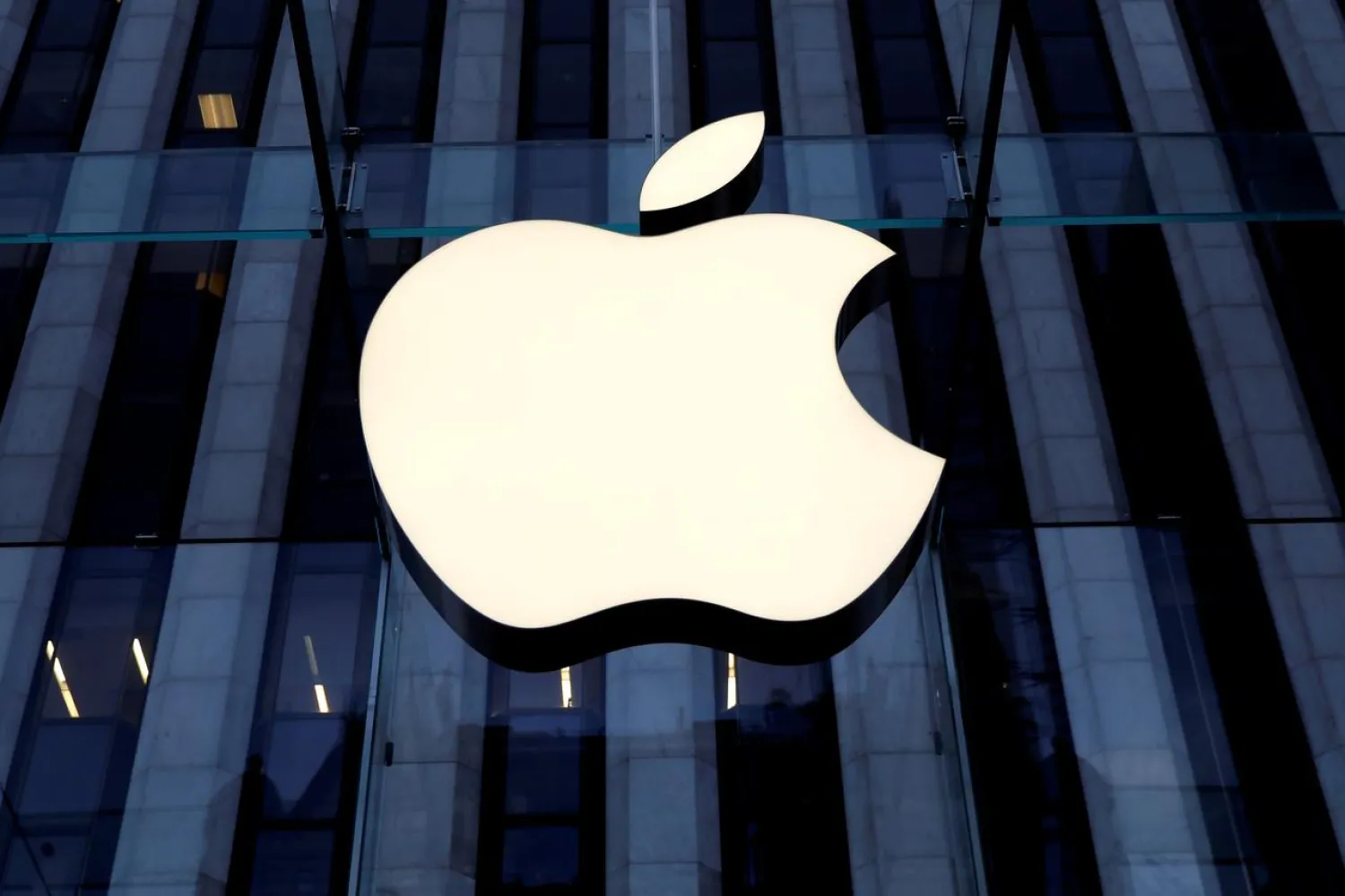 The Apple Inc. logo is seen hanging at the entrance to the Apple store on 5th Avenue in Manhattan, New York, US, October 16, 2019. (Reuters)