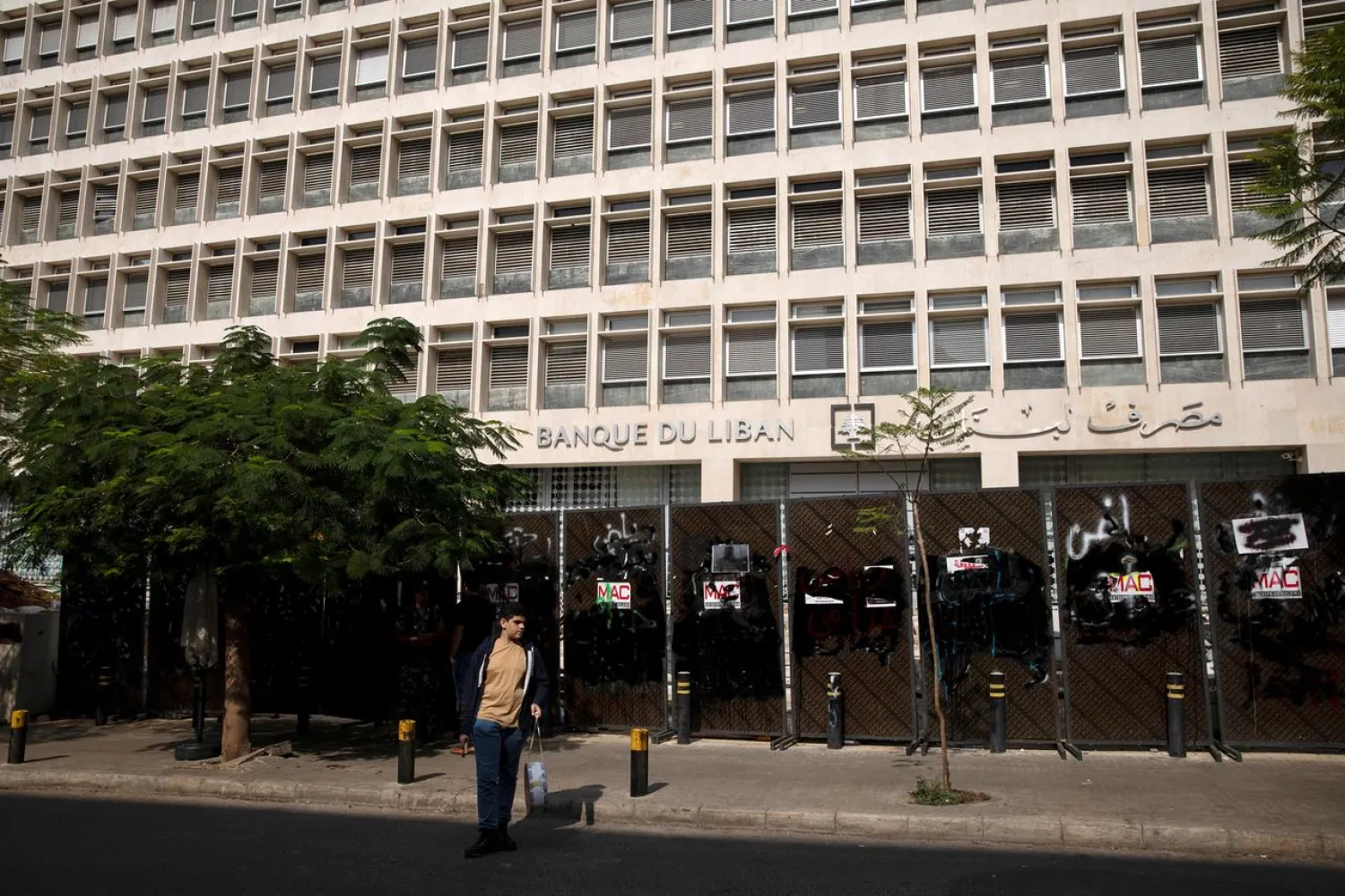 FILE PHOTO: A young demonstrator stands outside the Central Bank of Lebanon in Beirut, Lebanon, October 25, 2019. REUTERS/Alkis Konstantinidis
