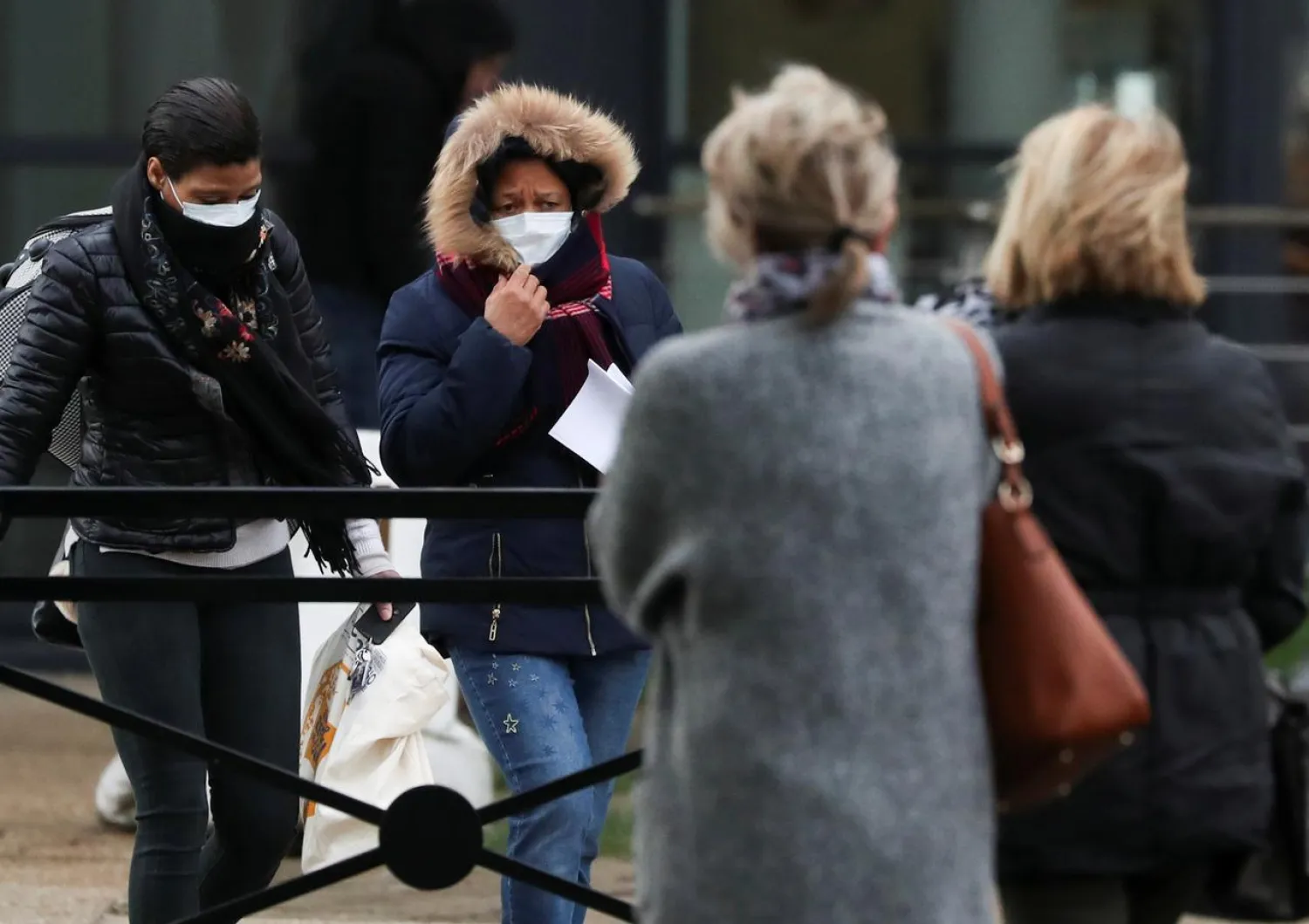 Women wearing masks leave a Creil's hospital, where people tested positive for coronavirus have been treated, France, February 27, 2020. REUTERS/Yves Herman
