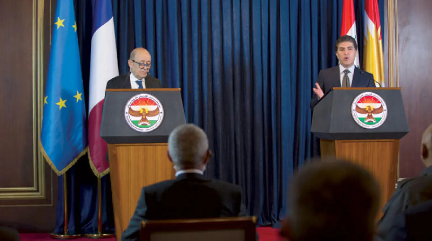 رئيس إقليم كردستان في مؤتمر صحافي مع وزير الخارجية الفرنسي في أربيل أمس (إ.ب.أ)