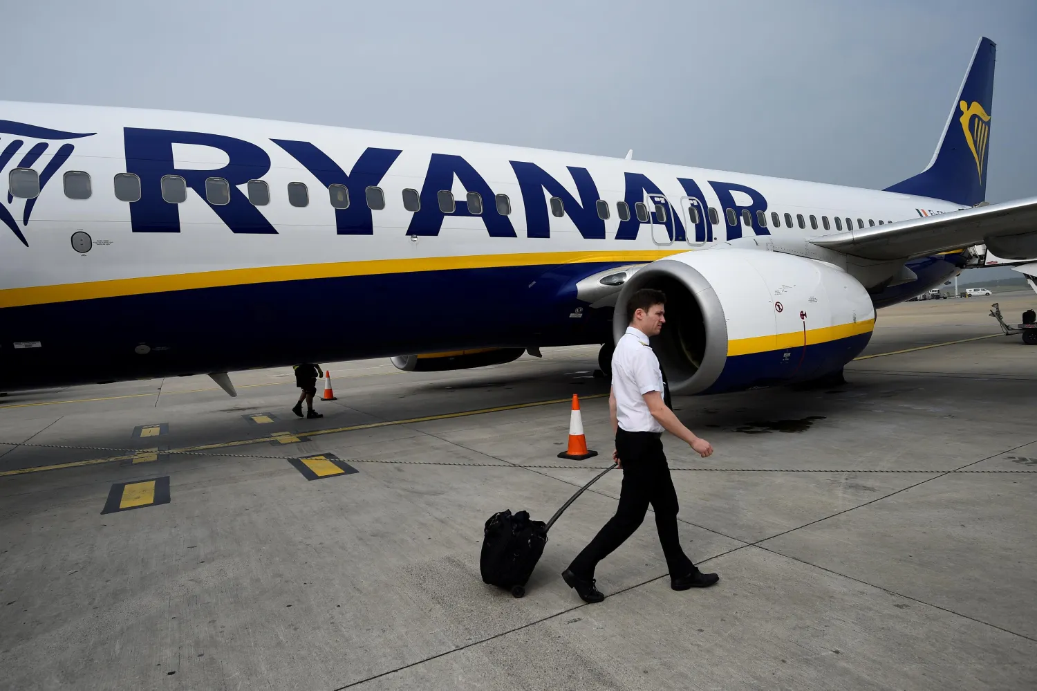 FILE PHOTO: A pilot disembarks a Ryanair flight at Stansted airport in London, Britain September 27, 2017. REUTERS/Clodagh Kilcoyne