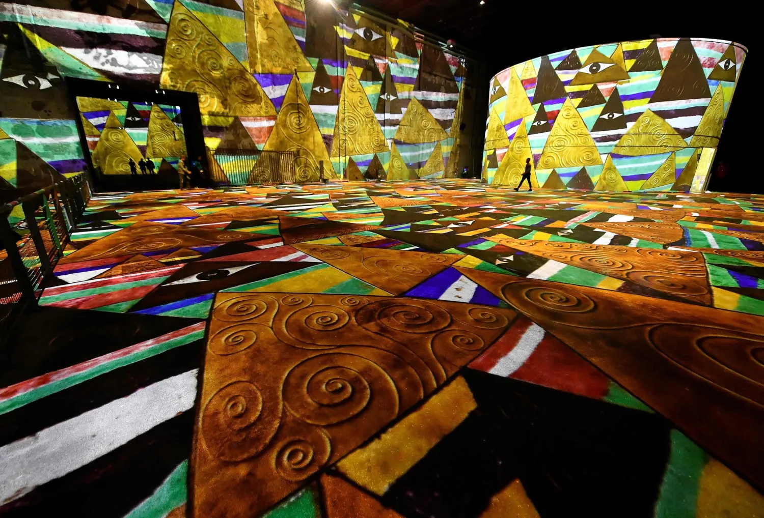 A scene from the “Gustav Klimt: Gold and Color” show at “Bassins de Lumières” in Bordeaux, France, in June.Credit...Georges Gobet/Agence France-Presse — Getty Images