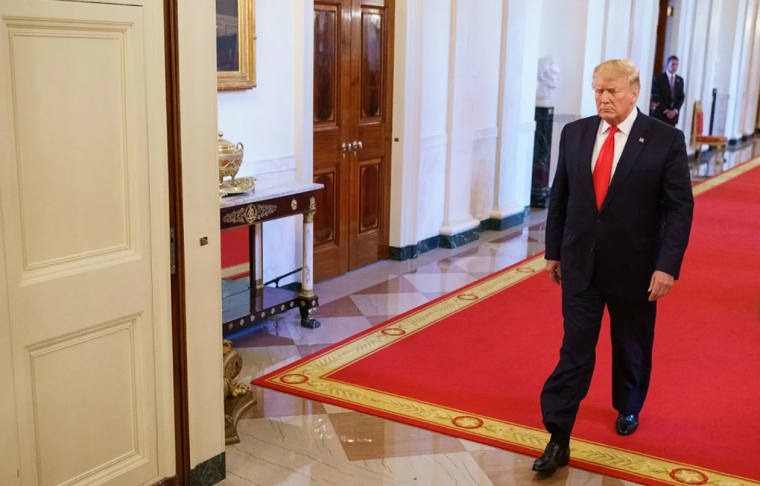 US President Donald Trump arrives to speak during a second chance hiring and criminal justice reform event in the East Room of the White House in Washington, DC, June 13, 2019. (AFP)
