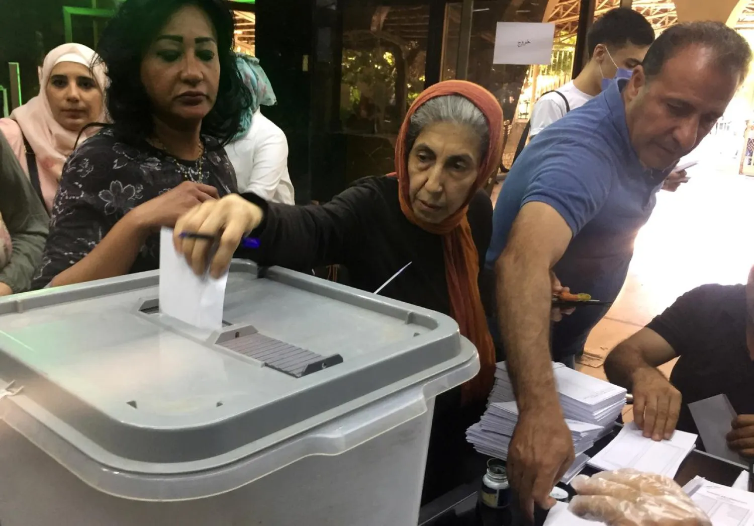 A woman casts her vote inside a polling stations during parliamentary elections in Damascus, Syria (Reuters)