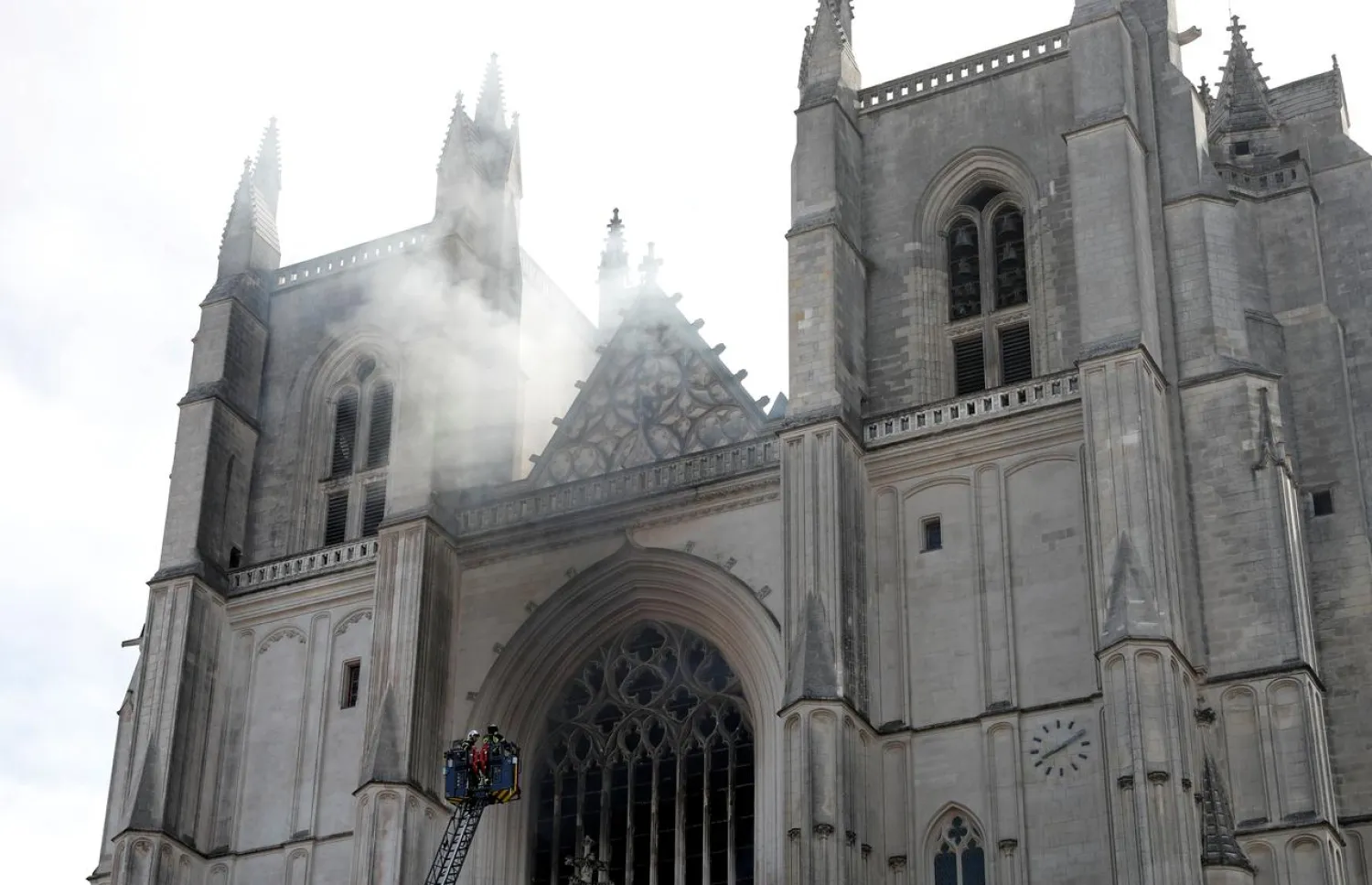 FILE PHOTO: French firefighters battle a blaze at the Cathedral of Saint Pierre and Saint Paul in Nantes, France, July 18, 2020. REUTERS/Stephane Mahe