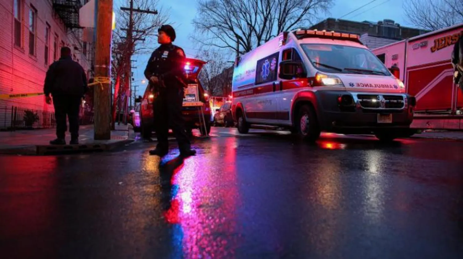 In this file photo Police officers attend an emergency on the scene of a shooting in Jersey City on December 10, 2019. (Photo by Kena Betancur / AFP)