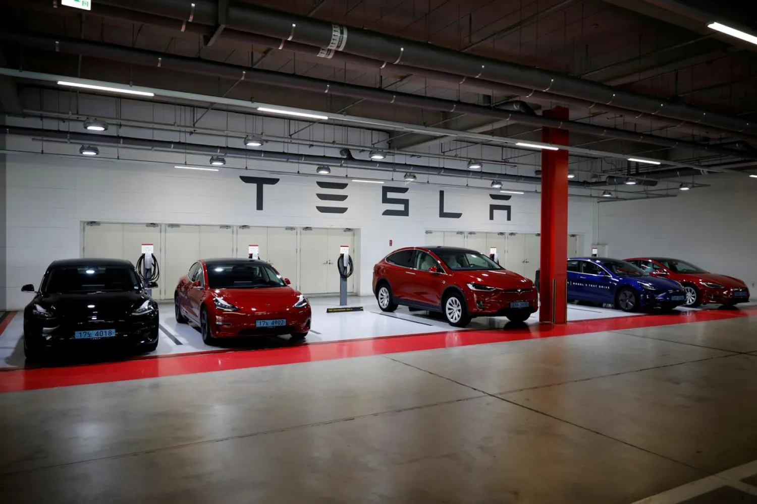 Tesla electric vehicles for test driving are parked in Hanam, South Korea, July 6, 2020. (Reuters)