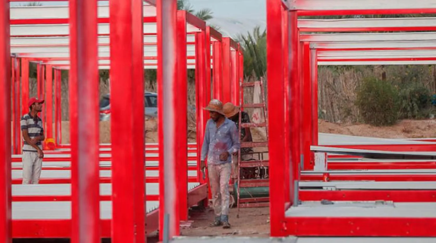 Palestinian workers building a field hospital in Deir al-Balah, the Gaza Strip. AFP file photo

 