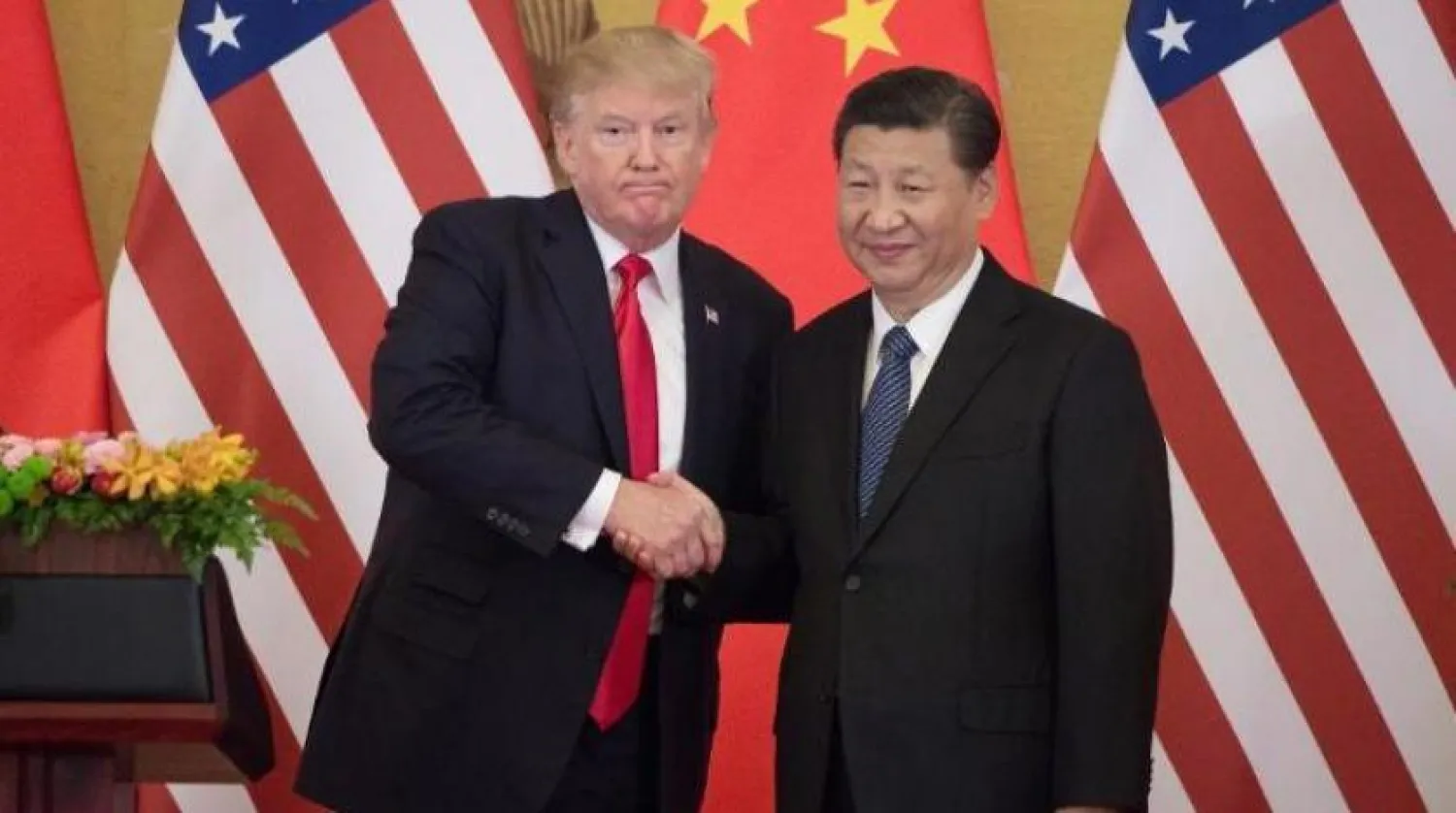 ABD Başkanı Donald Trump Çinli mevkidaşı ile görüştüğü sırada (AFP)