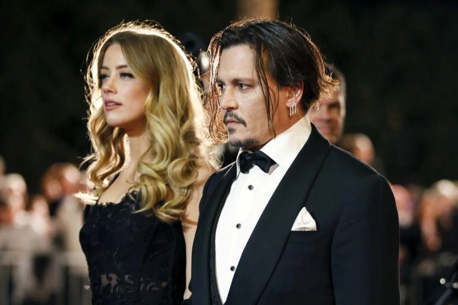 Desert Palm Achievement Award recipient actor Johnny Depp and wife actress Amber Heard pose at the 27th Annual Palm Springs International Film Festival Awards Gala in Palm Springs, California, January 2, 2016. REUTERS/Danny Moloshok