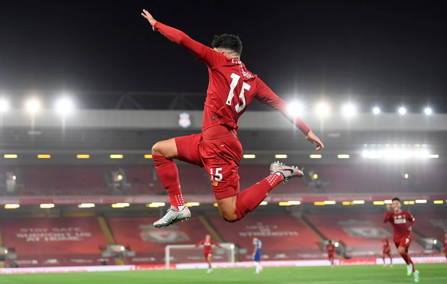 Liverpool’s Alex Oxlade-Chamberlain celebrates scoring his side’s fifth goal during the English Premier League match against Chelsea at Anfield stadium in Liverpool, England, July 22, 2020. (AP)