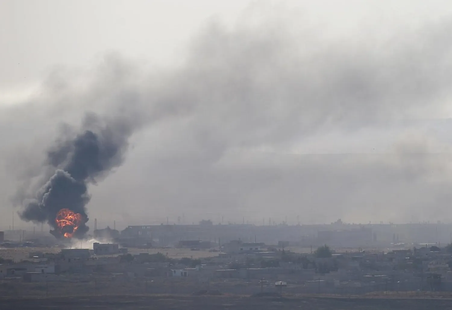 An explosion is seen over the Syrian town of Ras al-Ain as seen from the Turkish border town of Ceylanpinar, Sanliurfa province, Turkey, October 12, 2019. (Reuters)