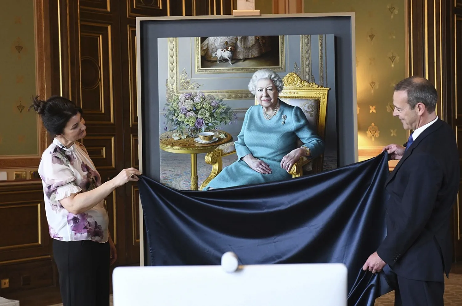 Britain’s Foreign Office has unveiled a new portrait of Queen Elizabeth by the artist Miriam Escofet. (AP)