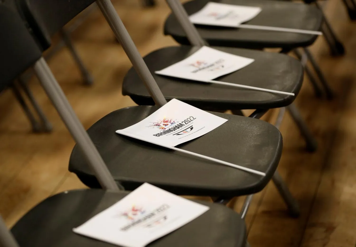 FILE PHOTO: Flags lie on seats before the announcement of the 2022 Commonwealth Games winning bid in Birmingham, Britain December 21, 2017. REUTERS/Darren Staples