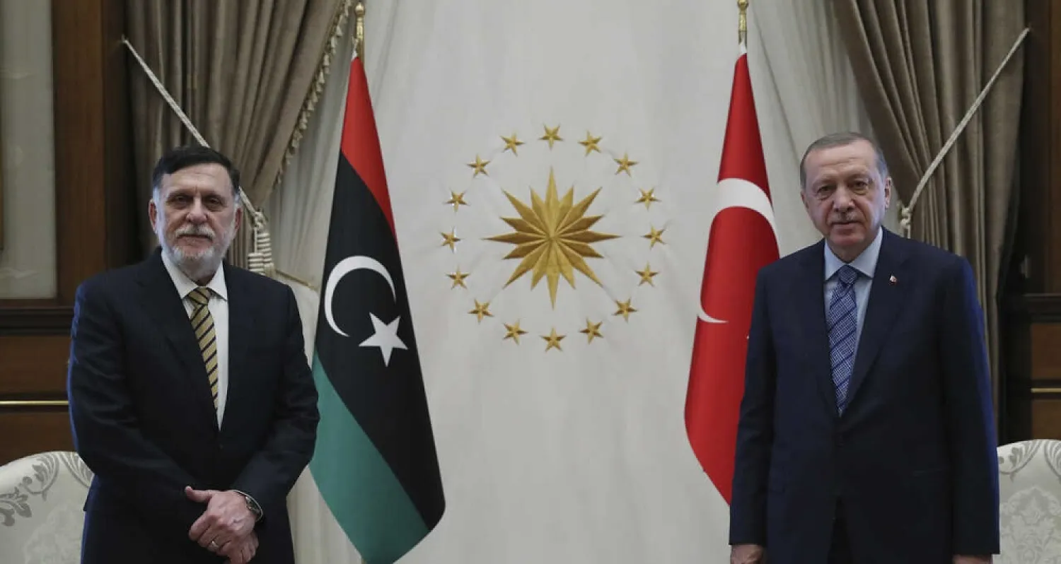 Turkey's President Erdogan, right, and GNA head, Fayez al-Sarraj, speak prior to their talks in Ankara, Turkey, June 4, 2020. (AP)