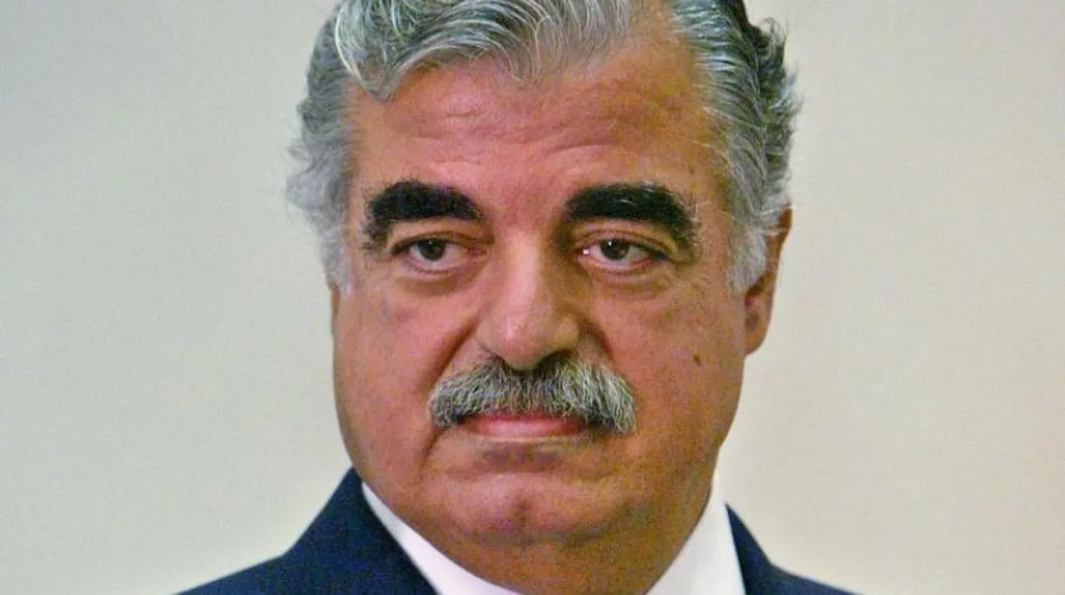 Lebanese former Prime Minister Rafik Hariri listens during a cabinet meeting in Beirut September 20, 2004. REUTERS/Jamal Saidi