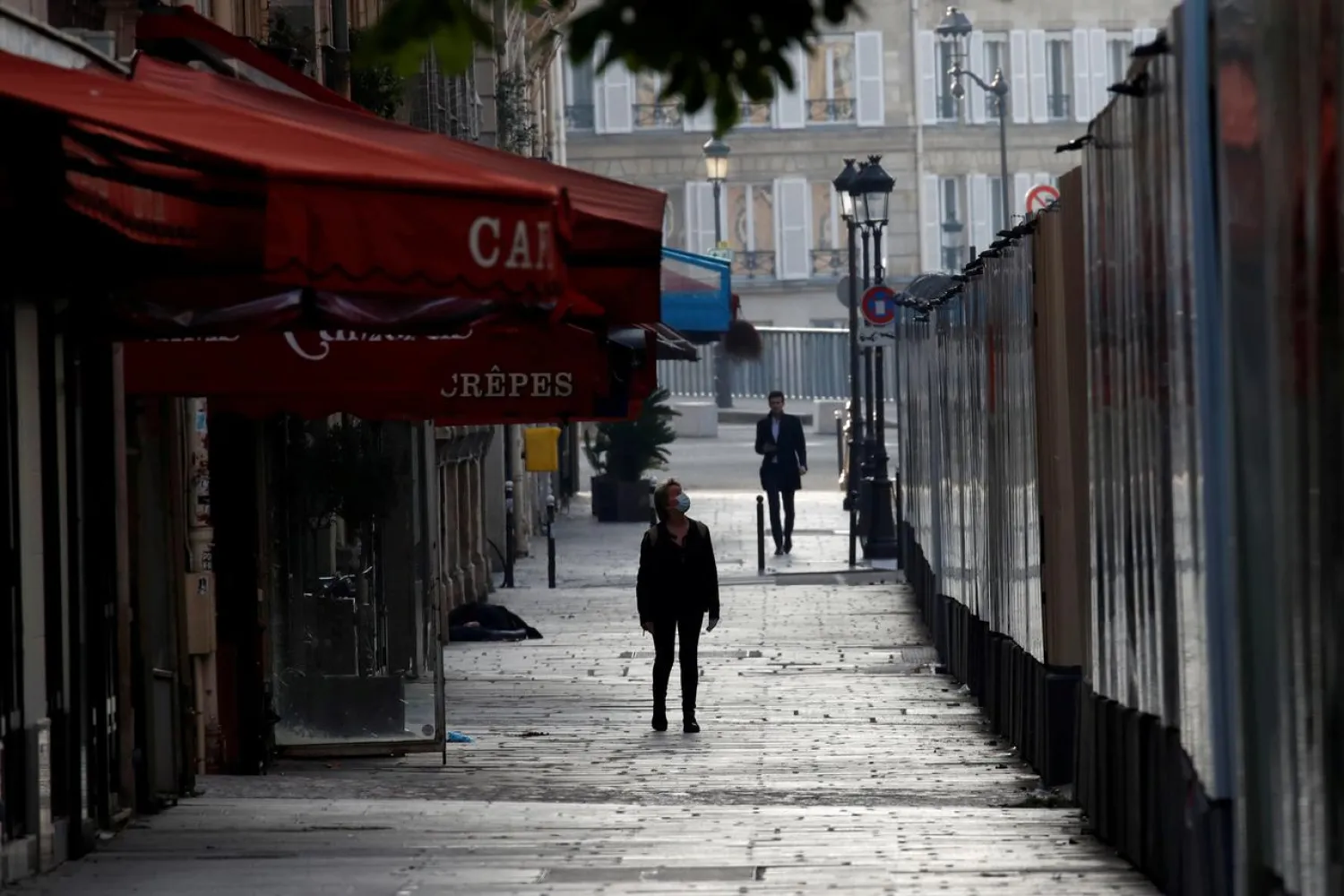 People walk observing safe social distance in Paris during a lockdown imposed to slow the spread of the coronavirus in France, April 7, 2020. (Reuters)