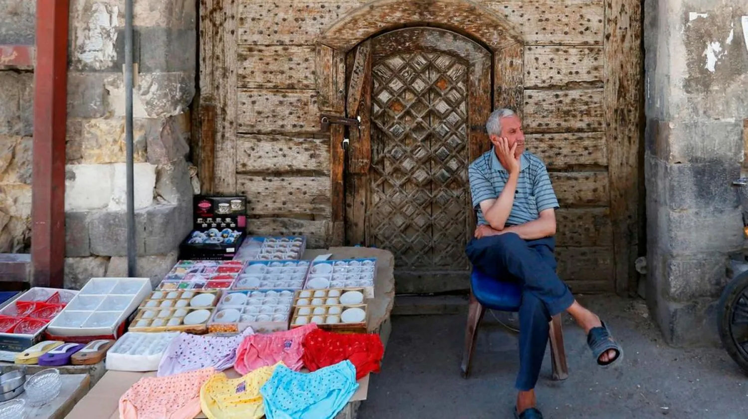 A Syrian street vendor waits for customers in old Damascus. (AFP)