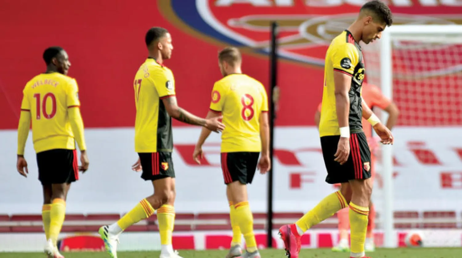 لاعبو واتفورد بعد السقوط أمام آرسنال والرحيل عن الأضواء (أ.ف.ب)