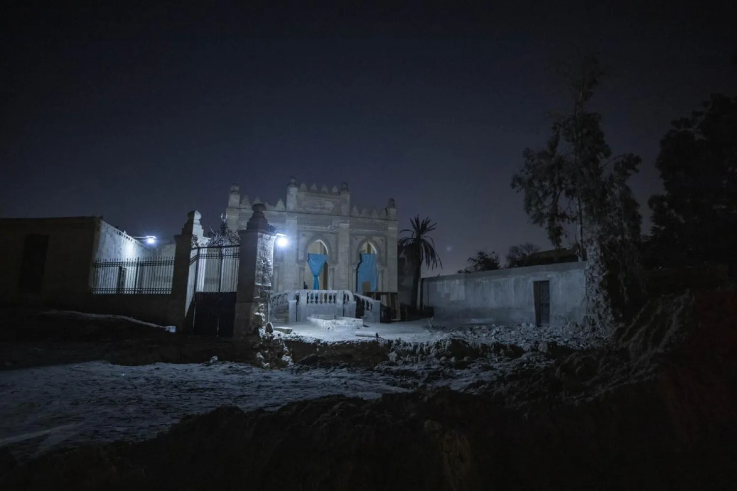 A tomb from the early 20th Century stands partially demolished amid construction of a new highway through the Northern Cemetery in Cairo, Egypt, Sunday, July 26, 2020. Dozens of graves have been partially or fully destroyed as the government builds two large expressways through the City of the Dead, a UNESCO World Heritage Site. (AP Photo/Nariman El-Mofty)