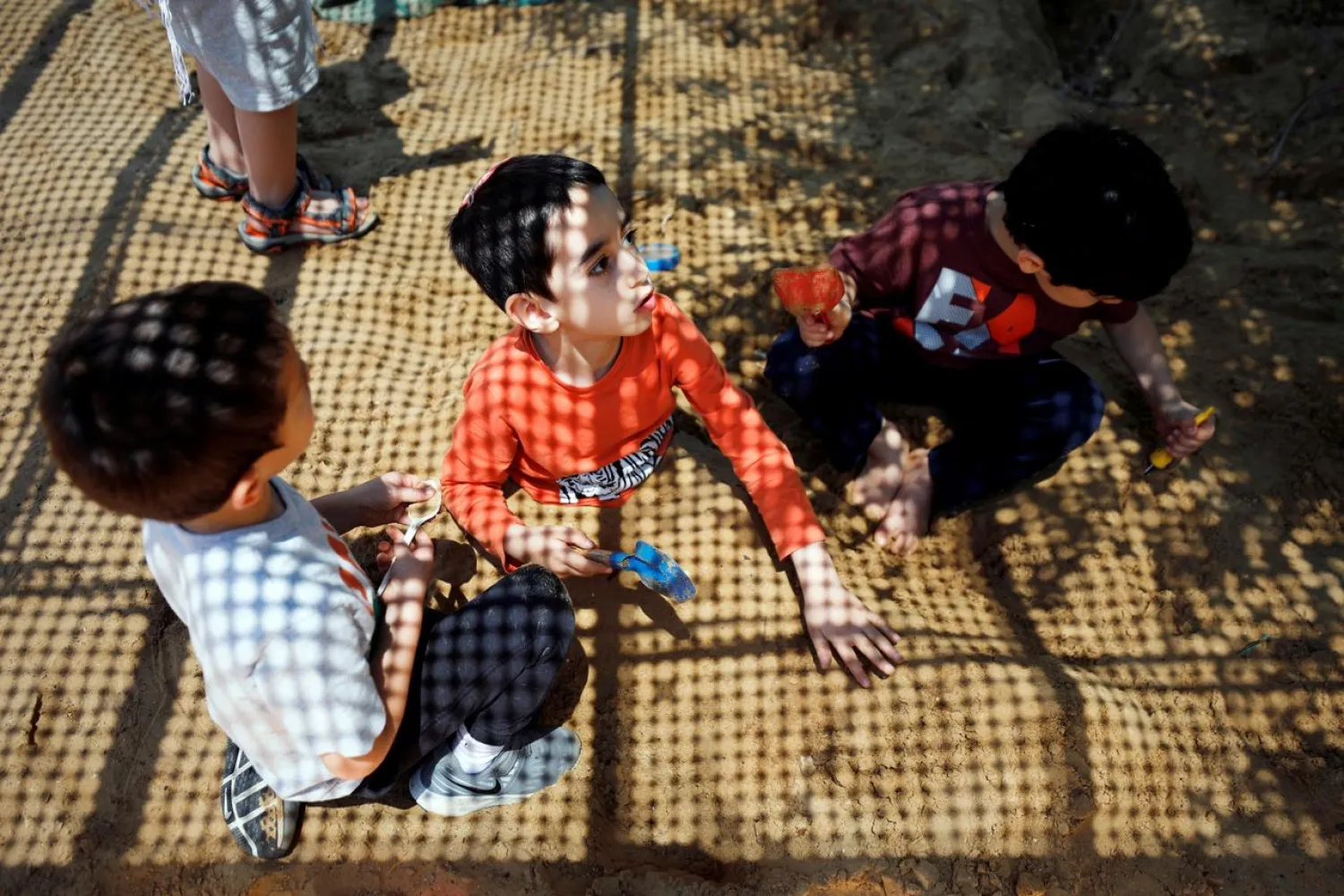 Children play at their kindergarten as Israeli preschools opened under the further easing of restrictions to prevent the coronavirus disease (COVID-19) spread, in Jerusalem May 10, 2020. REUTERS/Amir Cohen