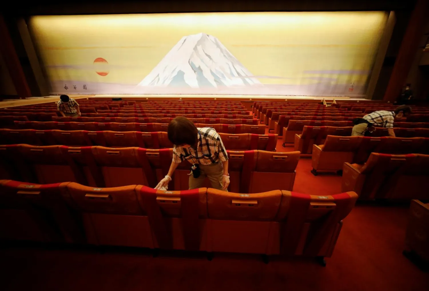 Workers disinfect seats at Tokyo’s famed Kabukiza Theater. (Reuters)