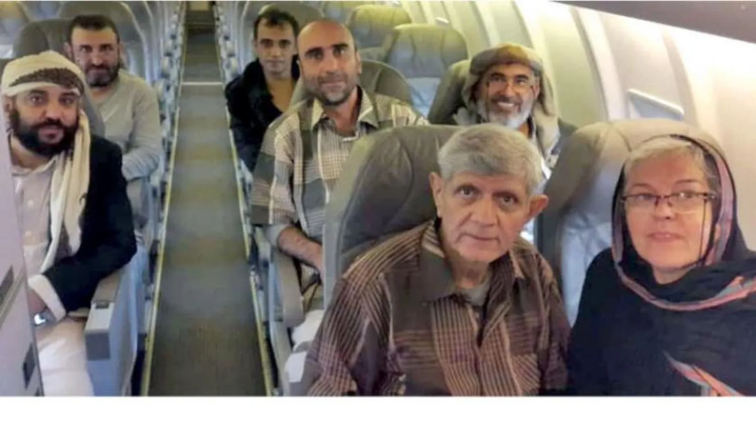 Deported Baha'i members on board a UN-provided plane. (social media)