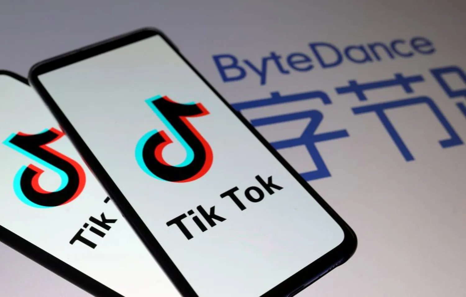FILE PHOTO: TikTok logos are seen on smartphones in front of a displayed ByteDance logo in this illustration taken November 27, 2019. REUTERS/Dado Ruvic/Illustration/File Photo
