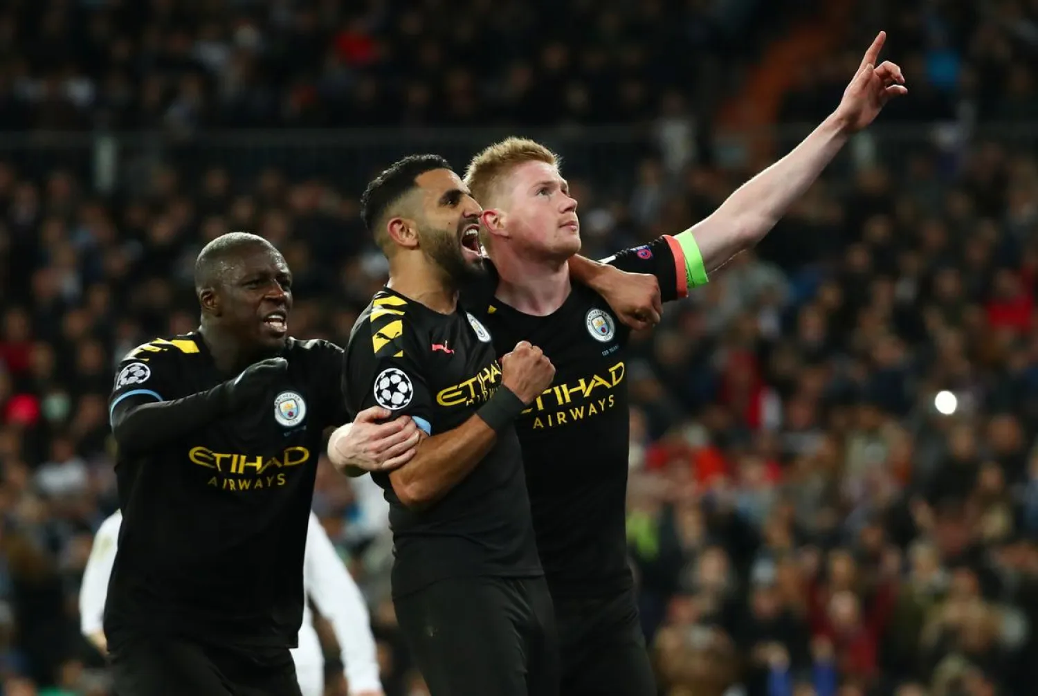 Manchester City players celebrate after scoring against Real Madrid in the first leg of the last-16 tie. (Reuters)