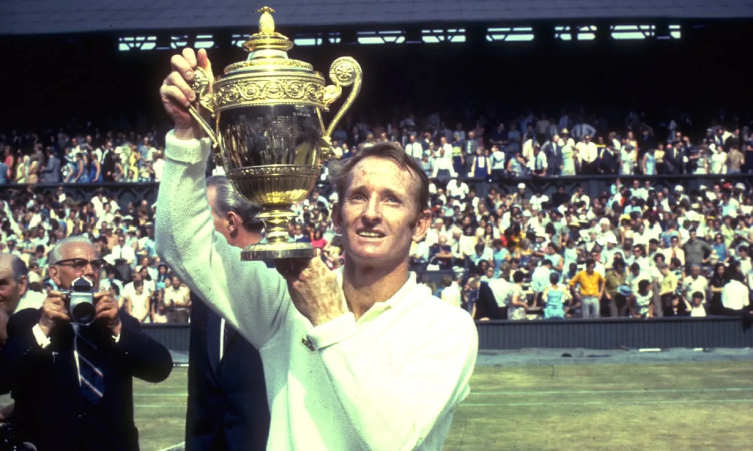Rod Laver lifts the men’s singles trophy at Wimbledon after beating his great rival and fellow Australian John Newcombe in 1969, the year he completed his second grand slam.
Photograph: Getty Images
