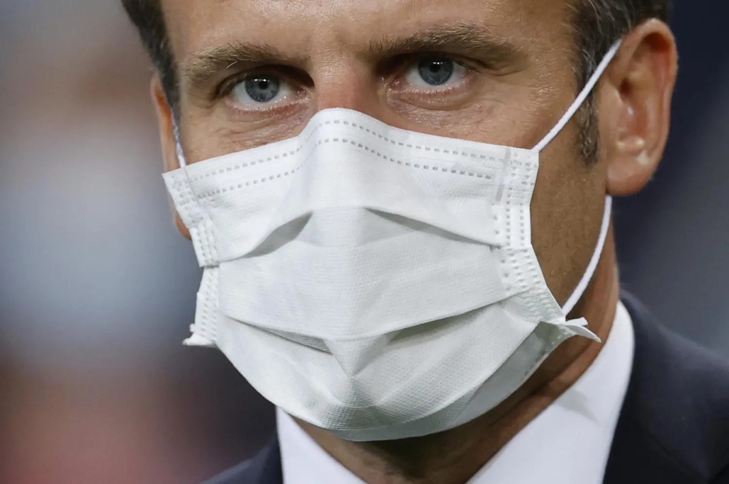 President of France Emmanuel Macron wearing a protective mask after the match, following the outbreak of the coronavirus disease (COVID-19) REUTERS/Christian Hartmann