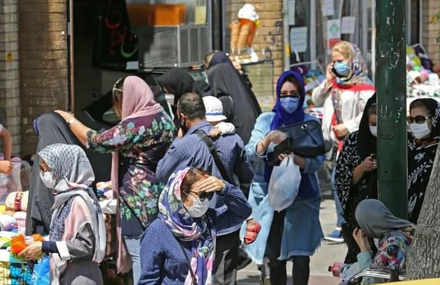 Iran's health ministry wants legislation to enable fines to be imposed on those who refuse to wear masks in enclosed public spaces -- at the moment they can only be refused service. AFP