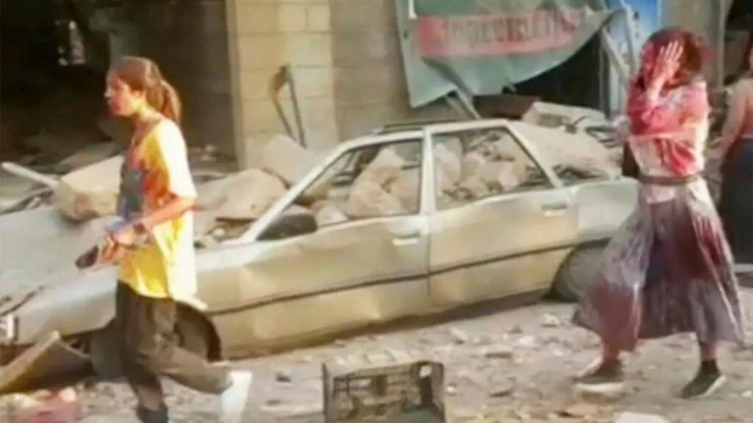 In this frame from video, people walk down the street after an explosion in Beirut, Aug. 4.  (AP)

 