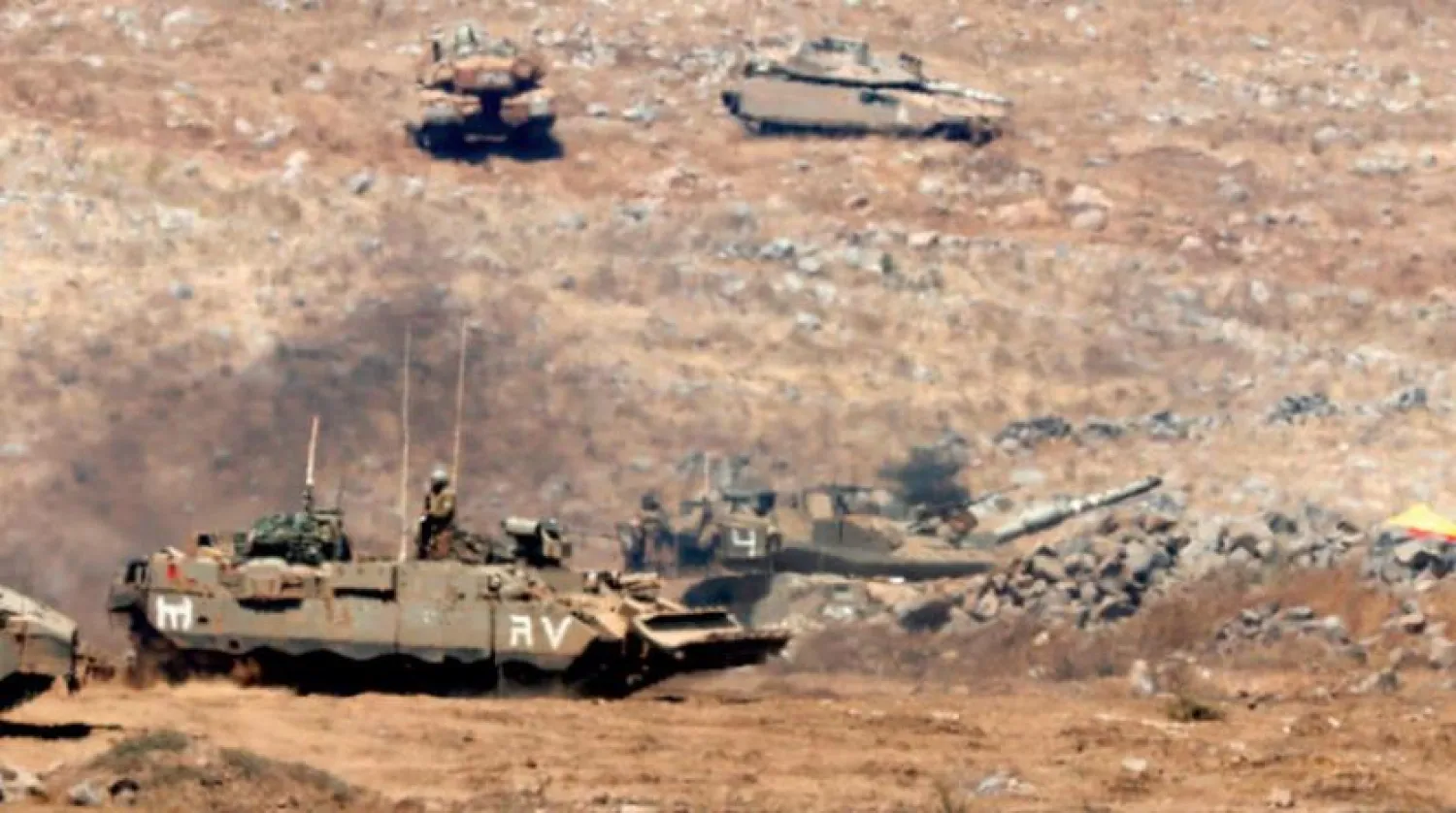 Israeli vehicles during maneuvers in the occupied Syrian Golan Heights (AFP)
