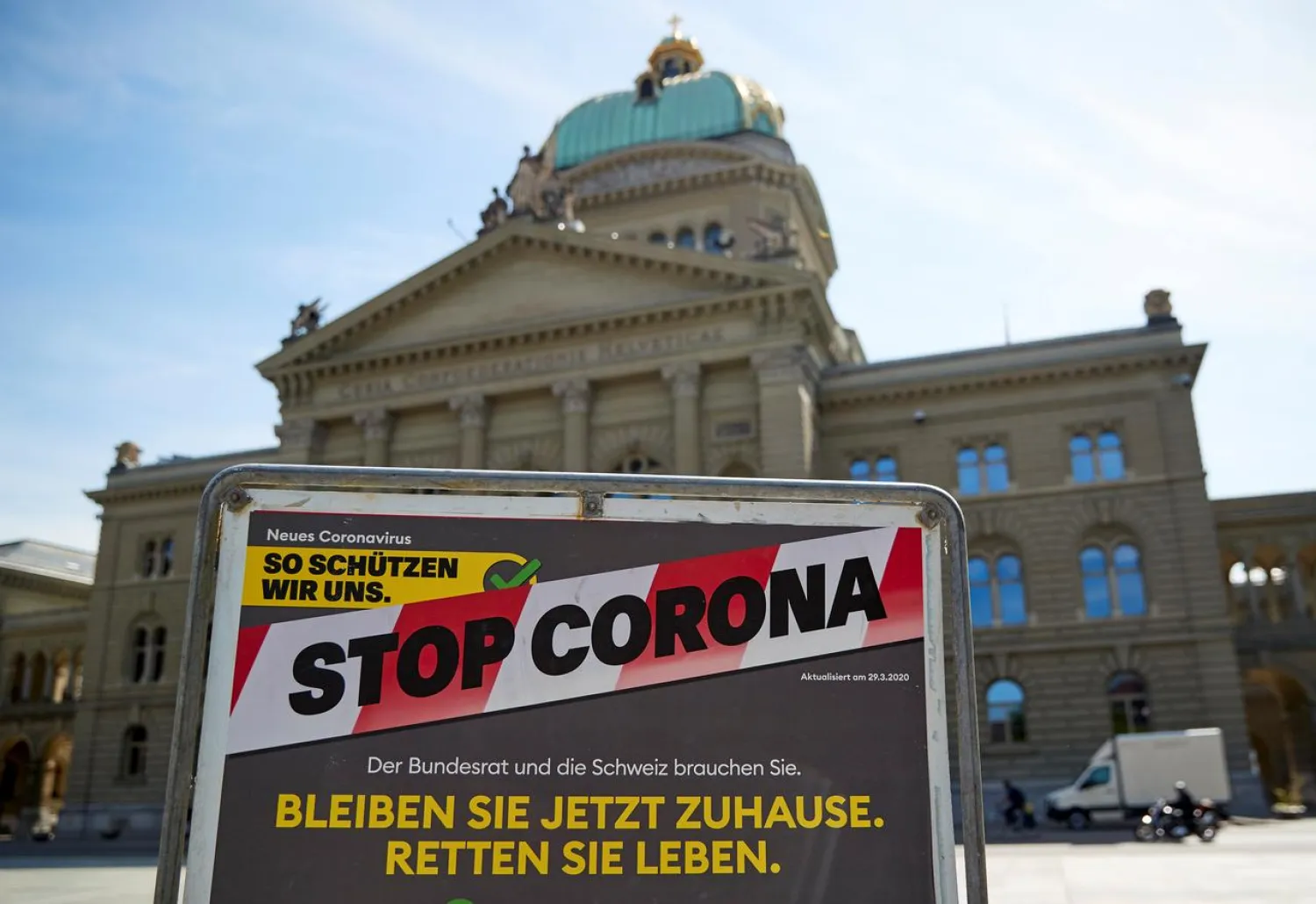 A sign is pictured in front of the Swiss Parliament Building (Bundeshaus) during a federal council meeting on the outbreak of the coronavirus disease (COVID-19) in Bern, Switzerland, April 16, 2020. REUTERS/Denis Balibouse
