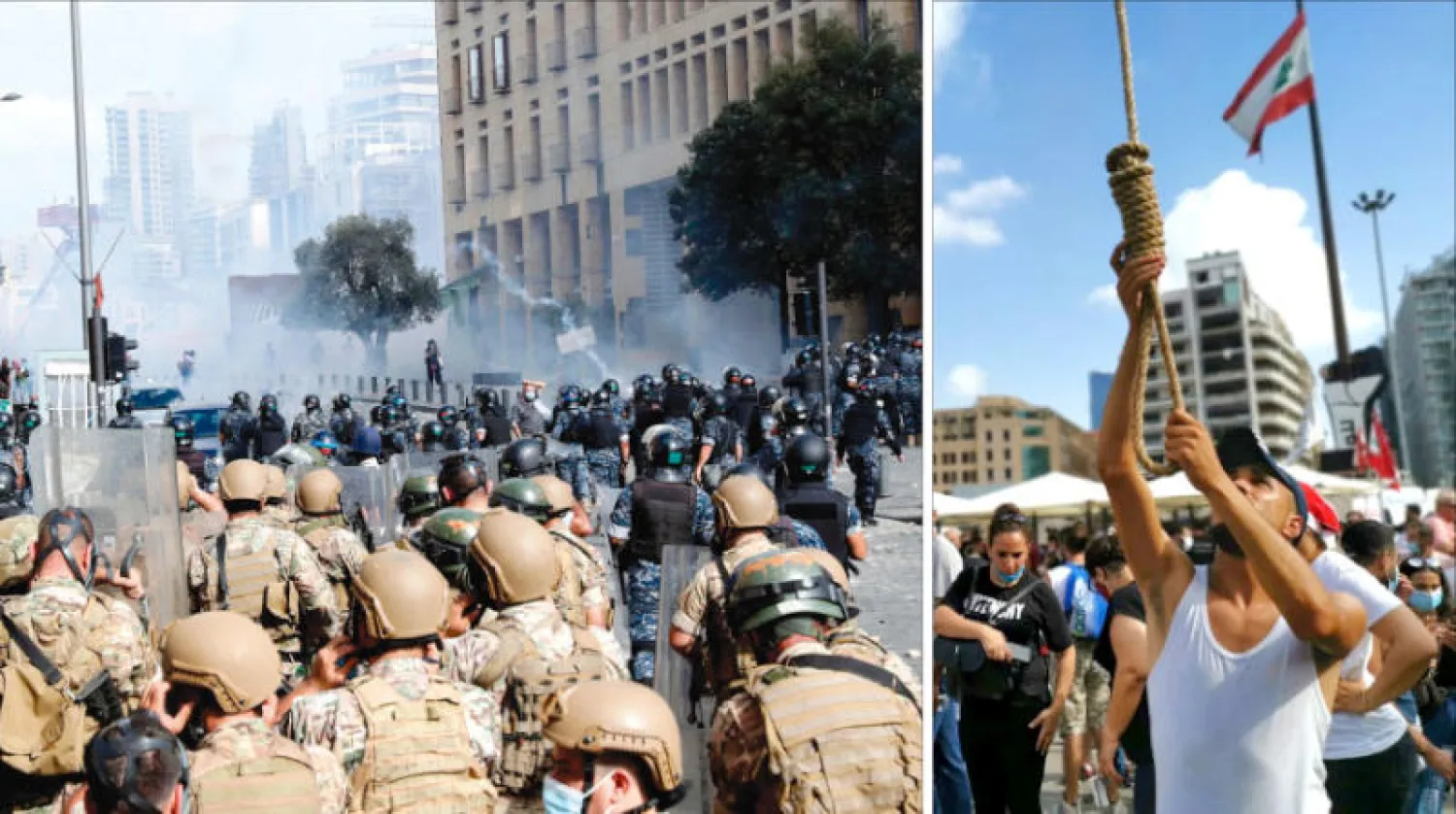محتجون يقيمون مشانق وهمية وسط بيروت أمس (إ.ب.أ)... ومواجهات بين متظاهري «يوم الحساب» وقوات الأمن (أ.ف.ب)