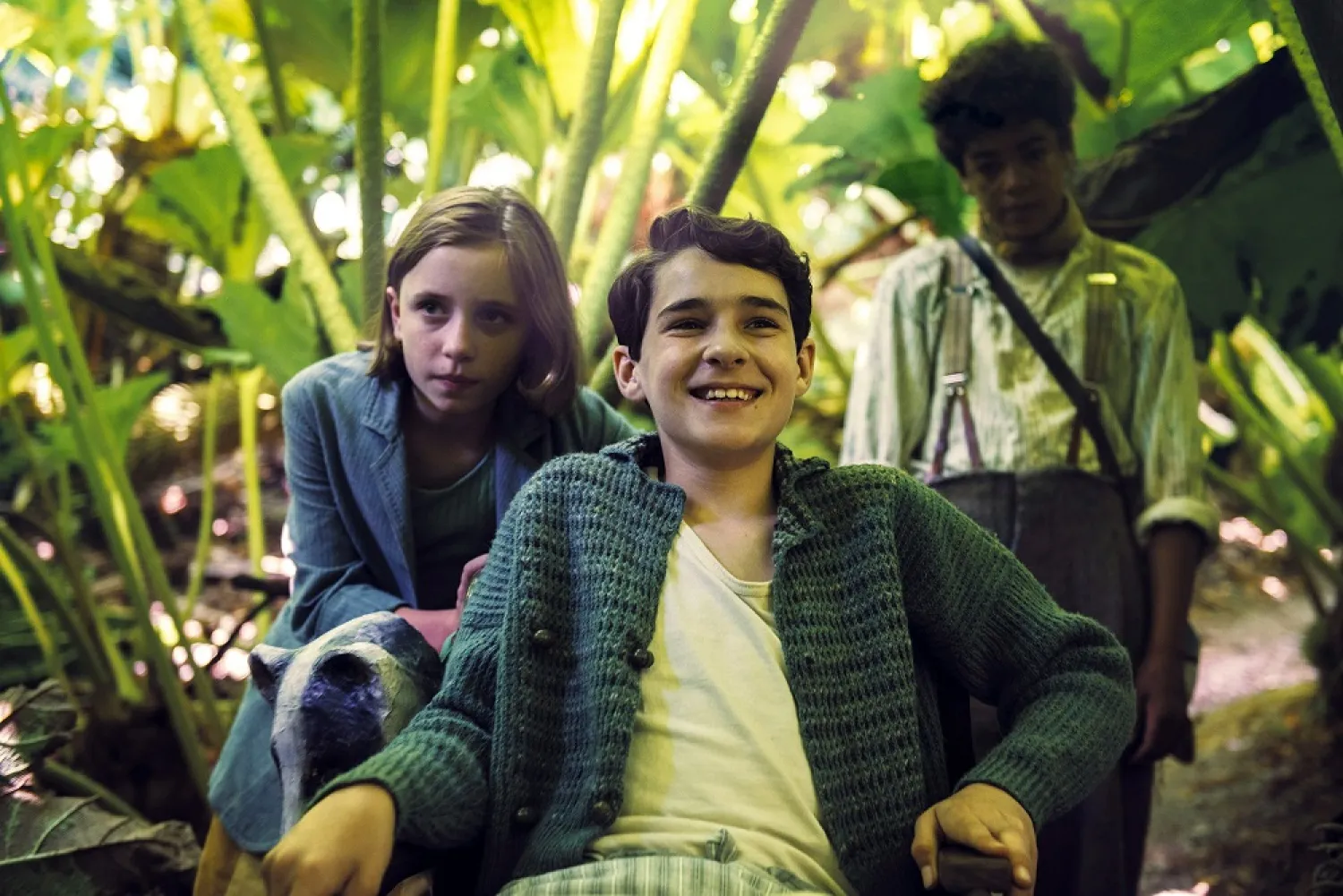 This image released by STXfilms shows Dixie Egerickx, Edan Hayhurst and Amir Wilson in a scene from ‘The Secret Garden.’ (STXfilms via AP)