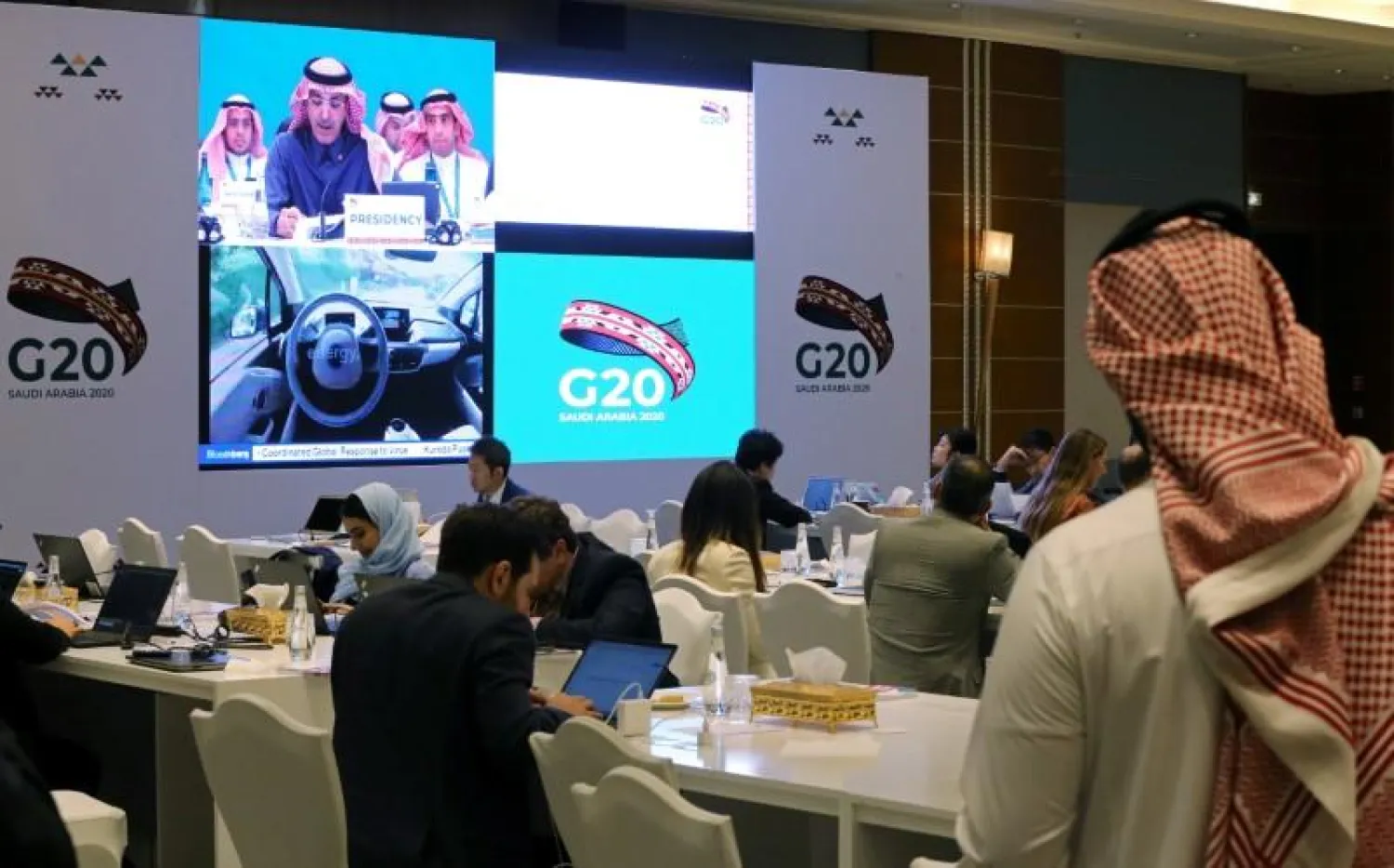 Journalists sit in the media center during the meeting of G20 finance ministers and central bank governors in Riyadh, Saudi Arabia, February 22, 2020/File Photo